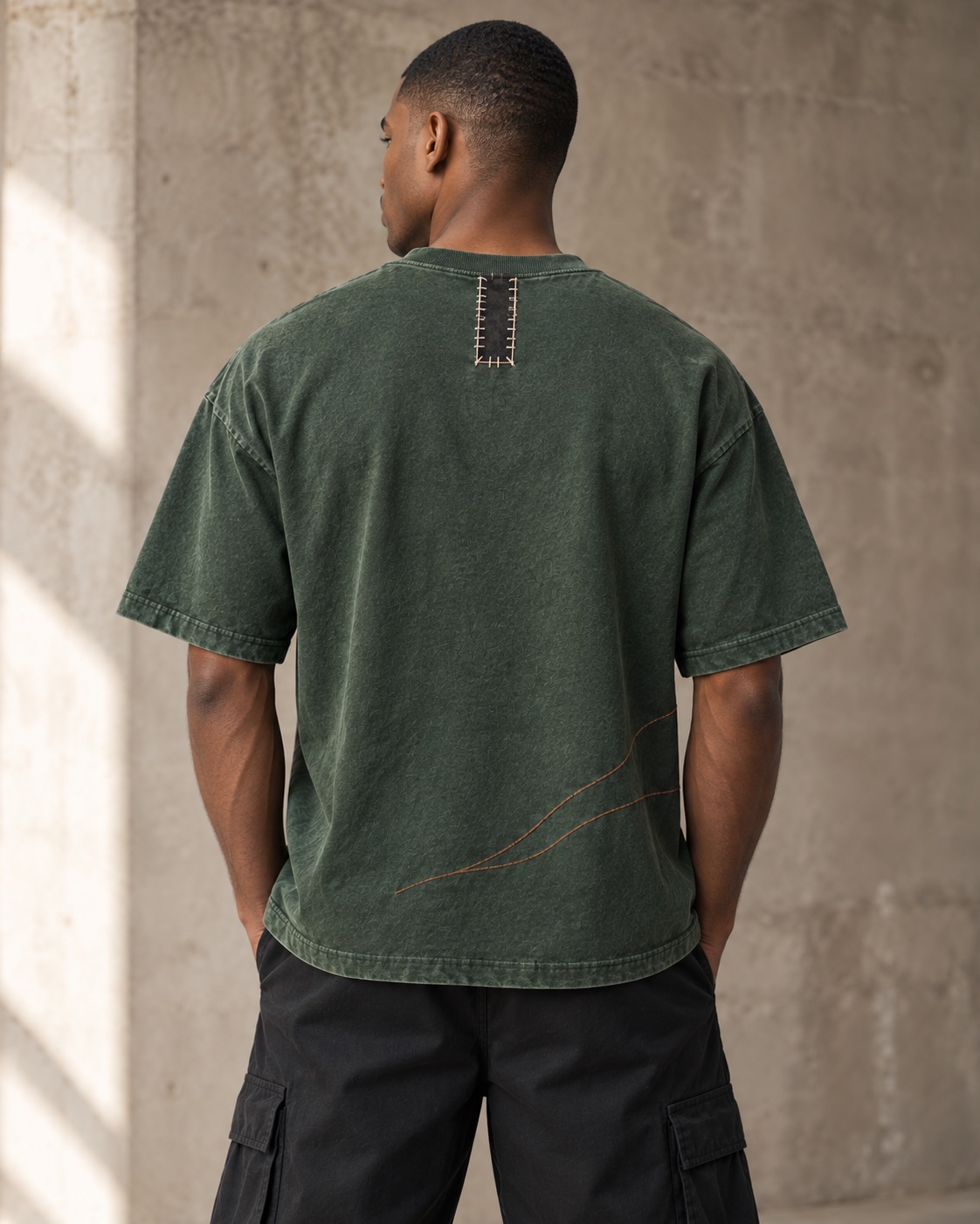 Back on-model view of the original appliqué embroidery t-shirt concept in forest / charcoal / copper