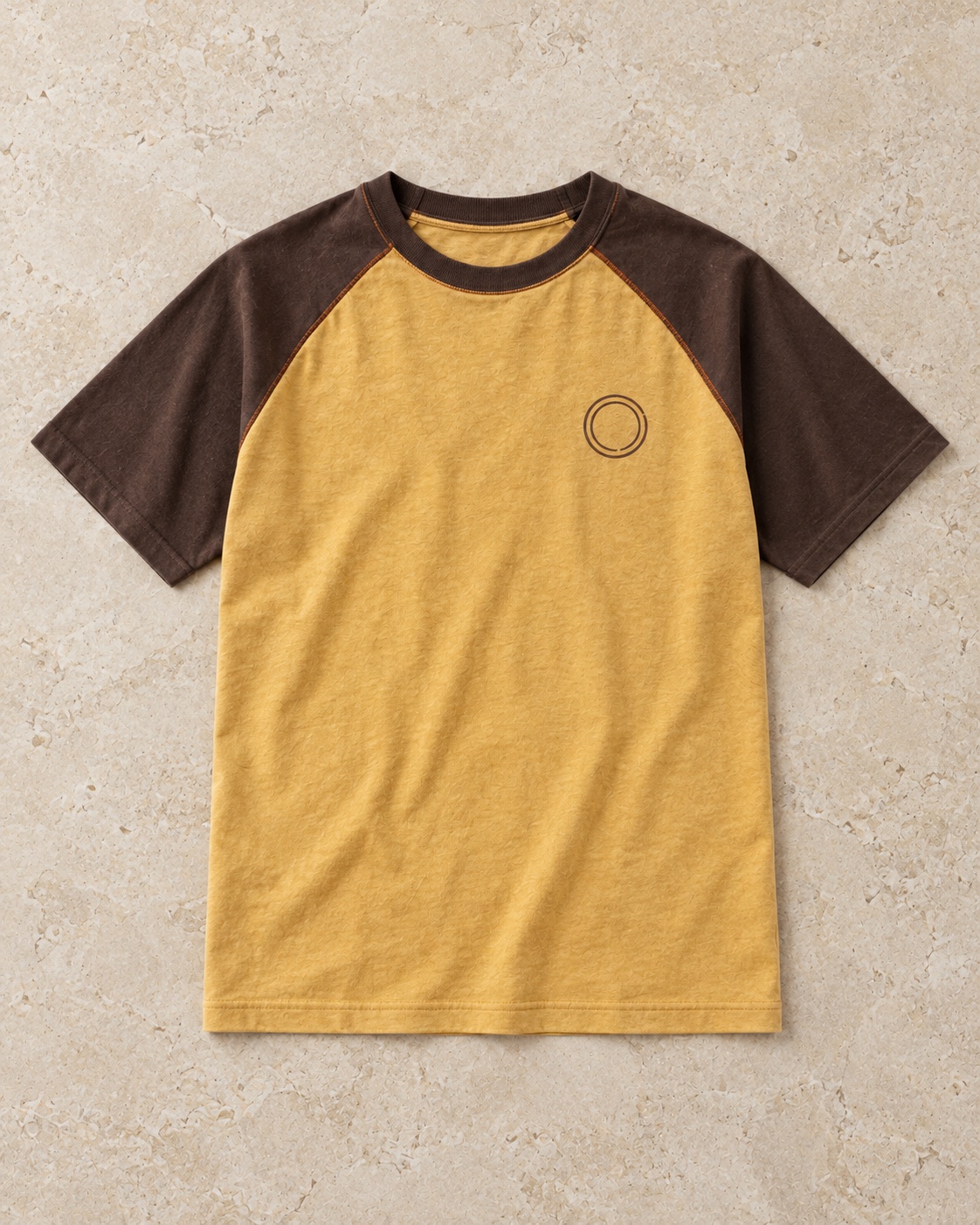 Full garment flat-lay of the original contrast raglan t-shirt concept in mustard / espresso