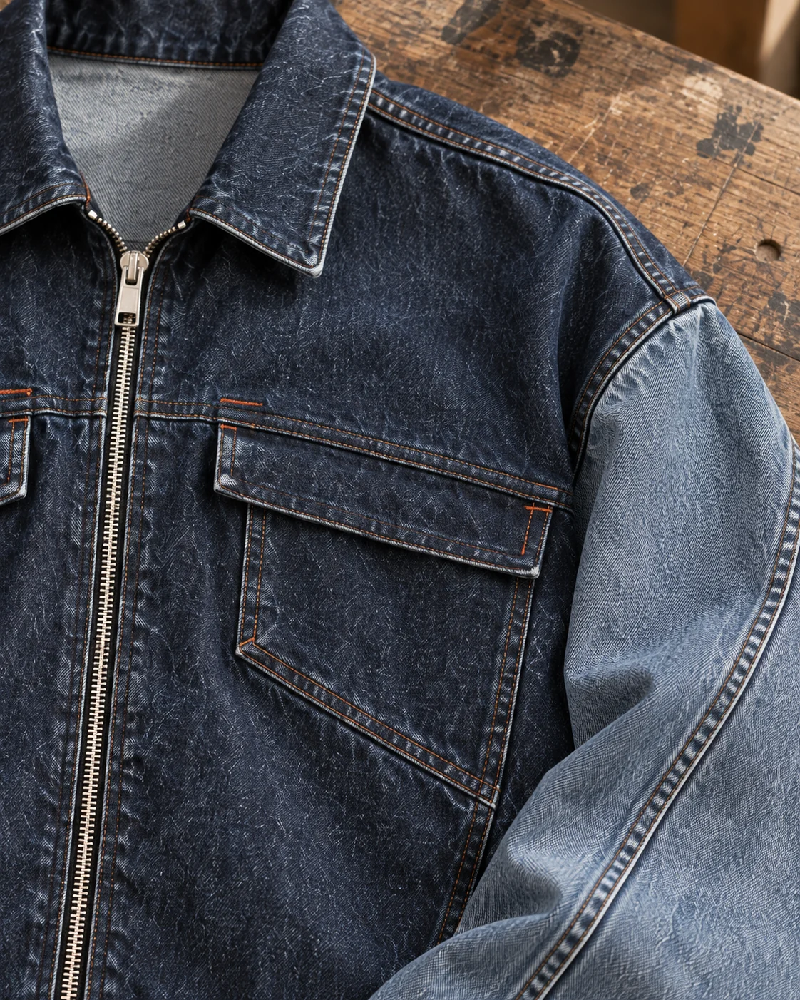 Close-up of fabric and signature construction — Cropped Boxy Denim Jacket in washed indigo / stone blue, AI-generated design concept