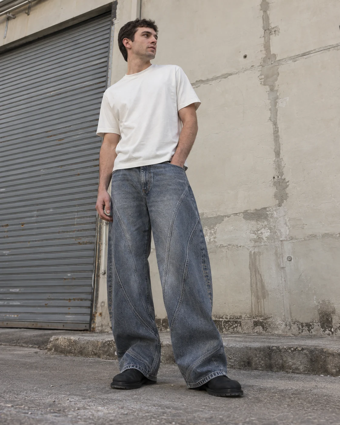 Front on-model view — Curved-Panel Jeans in slate blue / smoke grey, AI-generated design concept
