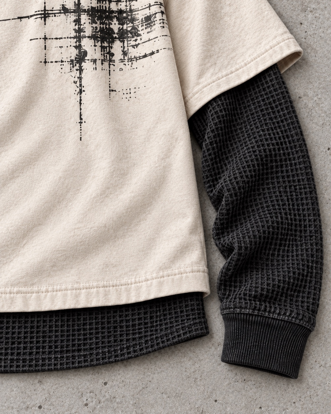 Fabric and construction close-up of the original double-layer thermal t-shirt concept in cream / charcoal