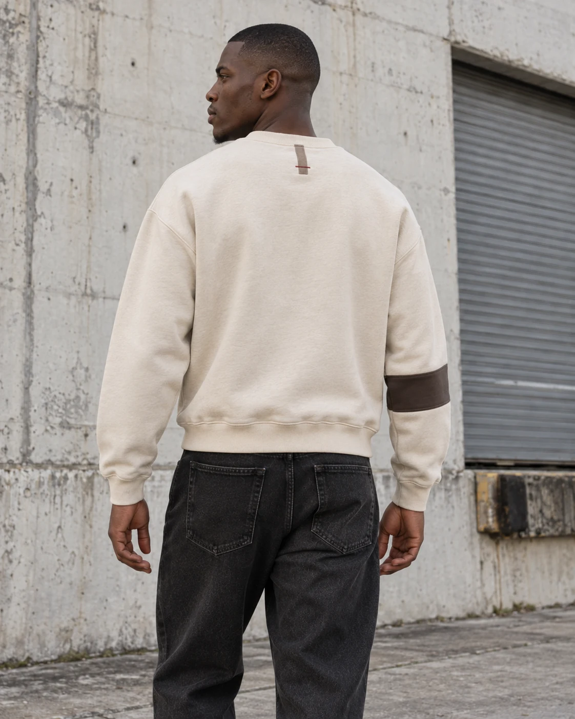 Distinct back design on the same model — Heavyweight Crewneck Sweatshirt in cream / taupe / espresso, AI-generated design concept