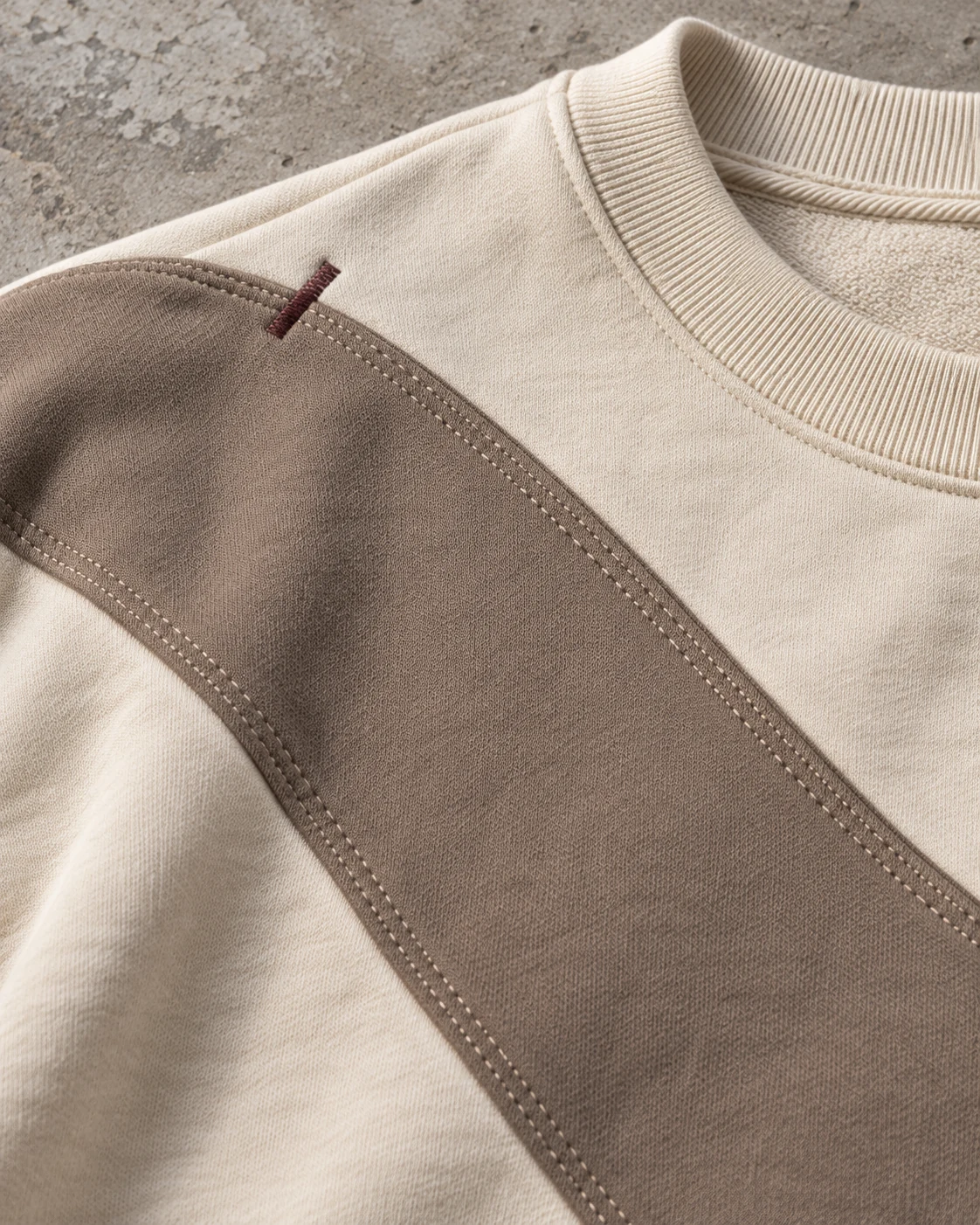 Close-up of fabric and signature construction — Heavyweight Crewneck Sweatshirt in cream / taupe / espresso, AI-generated design concept