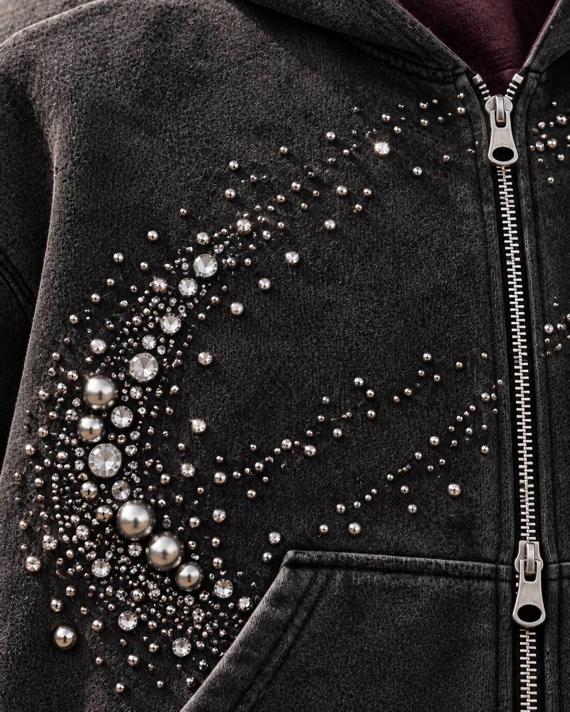 Close-up of fabric and signature construction — Rhinestone Zip Hoodie in charcoal / silver / plum, AI-generated design concept
